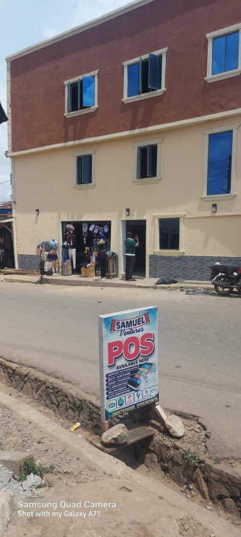 Newly built  A building mainly built for micro finance office with everywhere pop and tiles with another 2  shops on tarred road