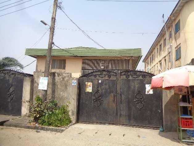 FOR SALE @ SATELLITE TOWN :  A Storey building consists of :  5br flat + 3br flat + 2br flat + 2no of 1br apartments, Security house on  640sqm