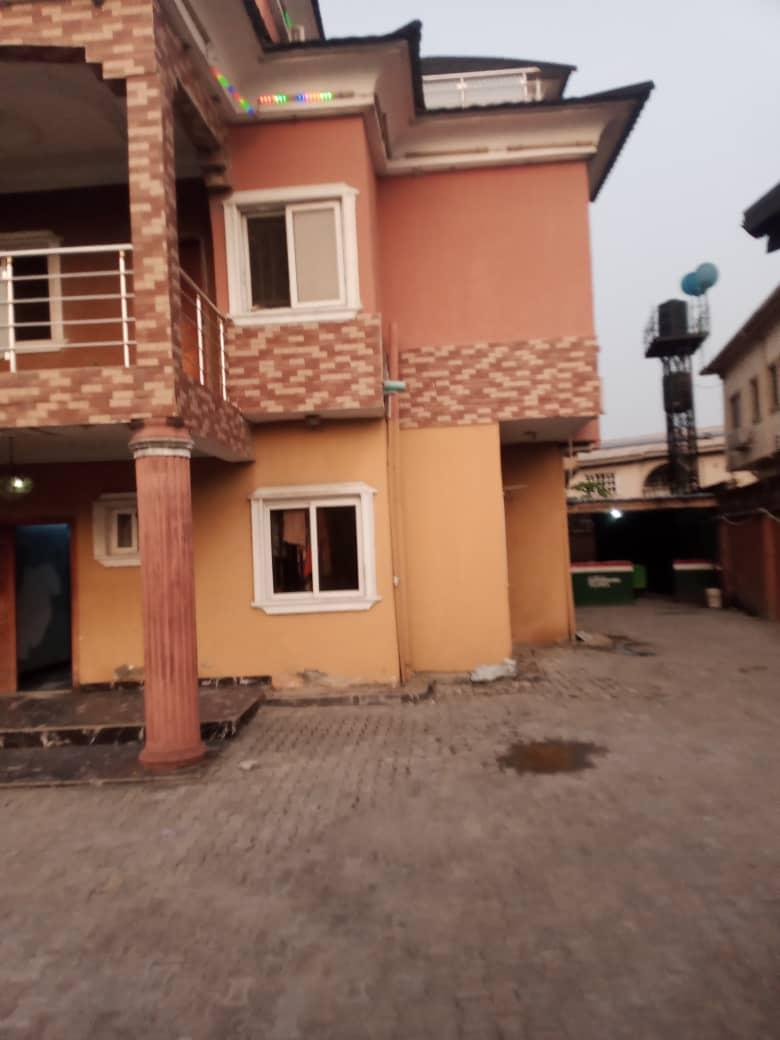 For long lease An entire compound and 2 two stories each structures in it suitable for hospital,school and restaurant In an estate Rent :30m yearly Long lease preferably
